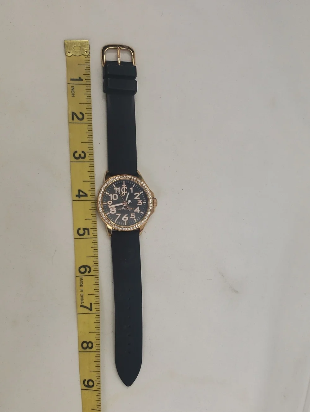 Juicy Couture tone gold